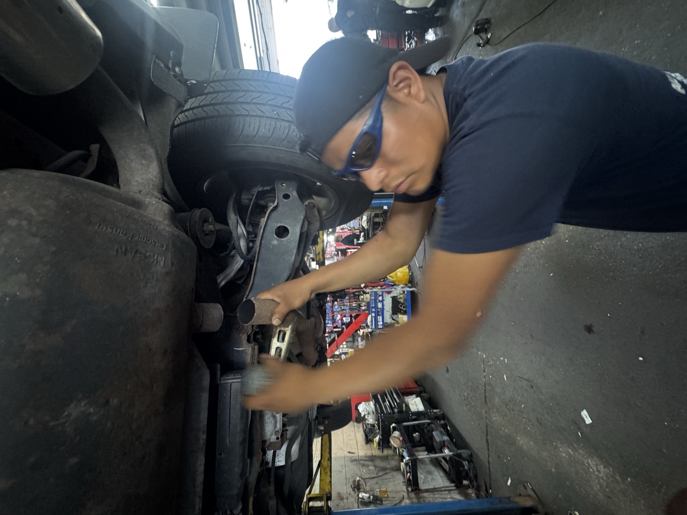 Mechanic working on brake rotor and caliper